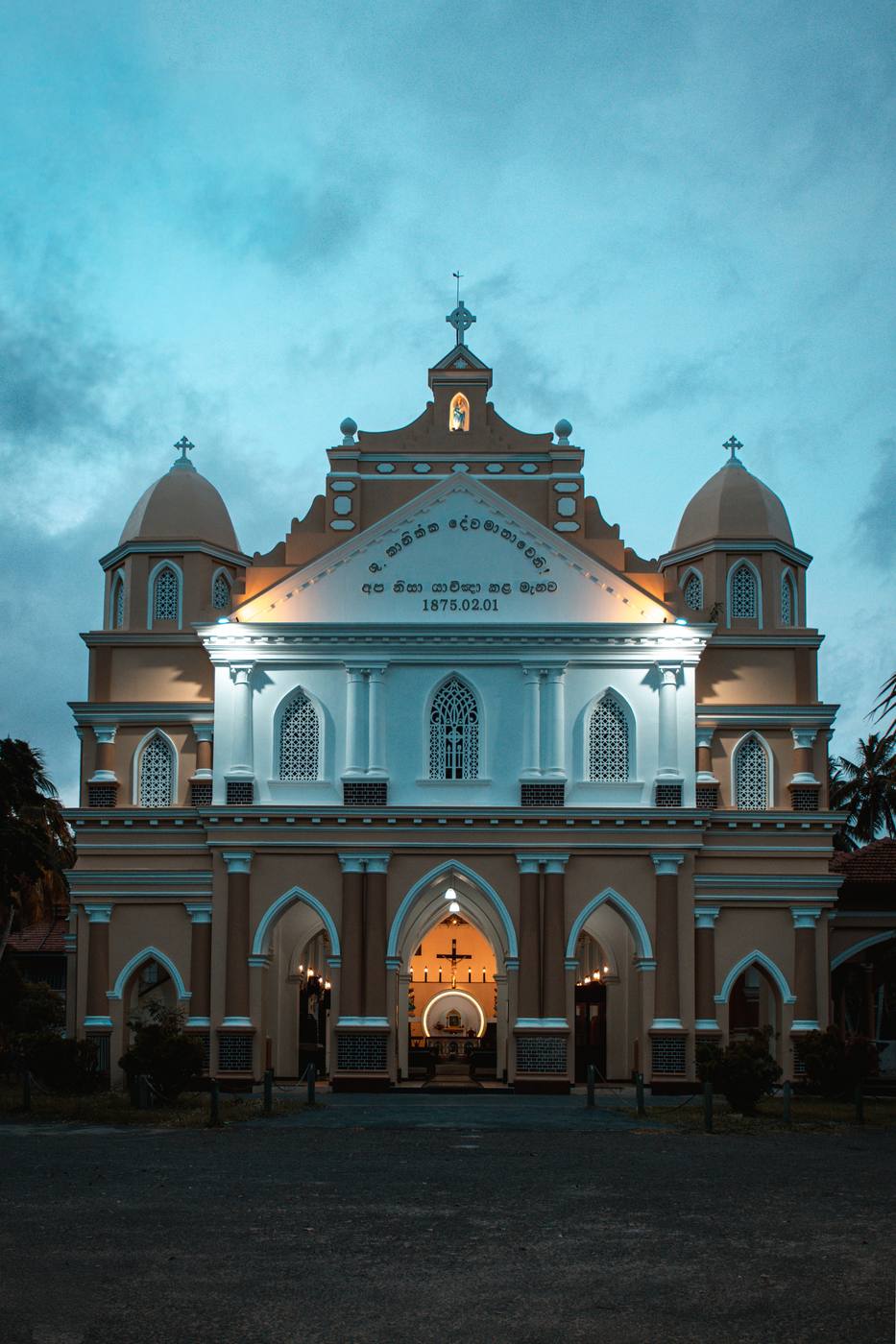Colonial-era Catholic church illuminated at dusk on Sri Lanka's west coast