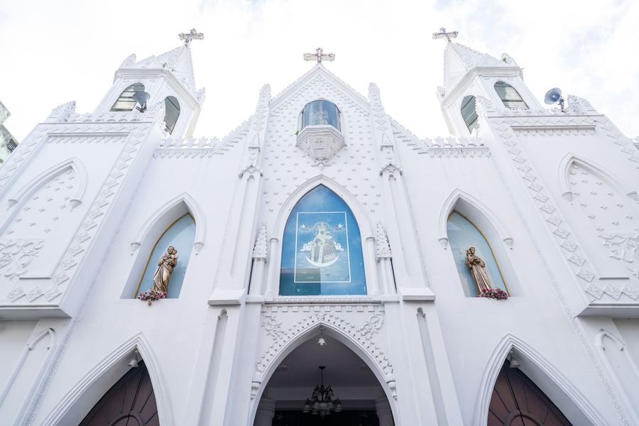 Ornate white Catholic church facade in Negombo
